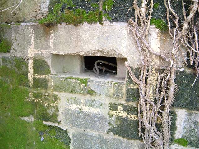 False window frame painted around the Loophole on the side of a Type 26 Pillbox at Axminster Ngr SY290980. Picture by Tim Denton 2004.