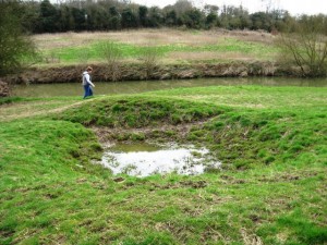 Bomb crater beside the footpath on the River Medway, Teston. Picture by David Ottway.