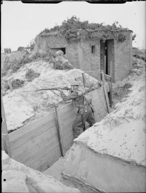 A soldier of the 4th Battalion, The Royal Norfolk Regiment, mans a trench near a pillbox at Great Yarmouth, 31 July - 2 August 1940 H 2702 Part of WAR OFFICE SECOND WORLD WAR OFFICIAL COLLECTION Subject period Second World War Alternative Names object category: Black and white Creator War Office official photographer Category photographs
